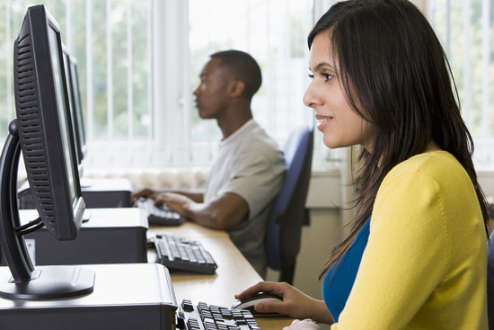 Students taking MBLEx test on computers.